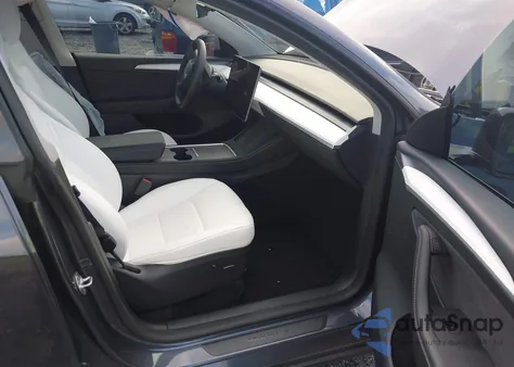 2023 Tesla Model Y Rwd z USA, uszkodzony, nr VIN 7SAYGDED2PF940784